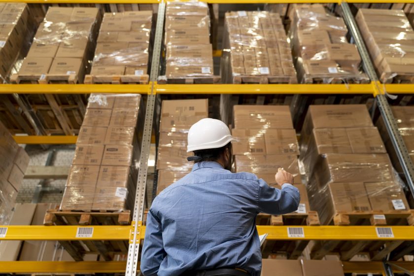 man-with-helmet-working-in-warehouse
