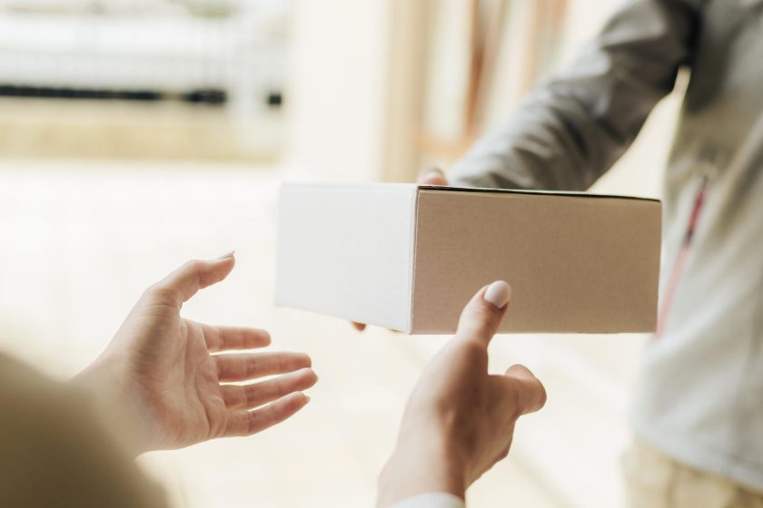 close-up-hands-getting-box