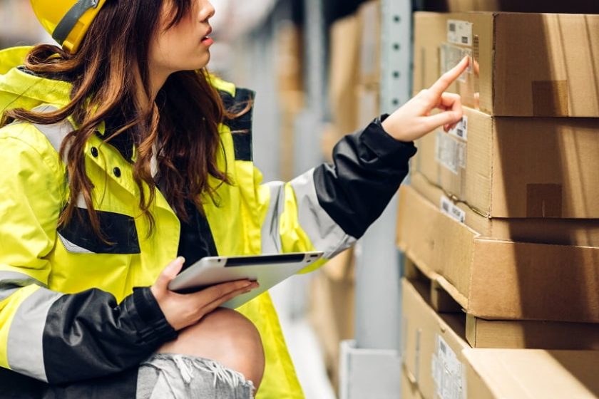 Portrait asian engineer woman shipping order detail on tablet ch